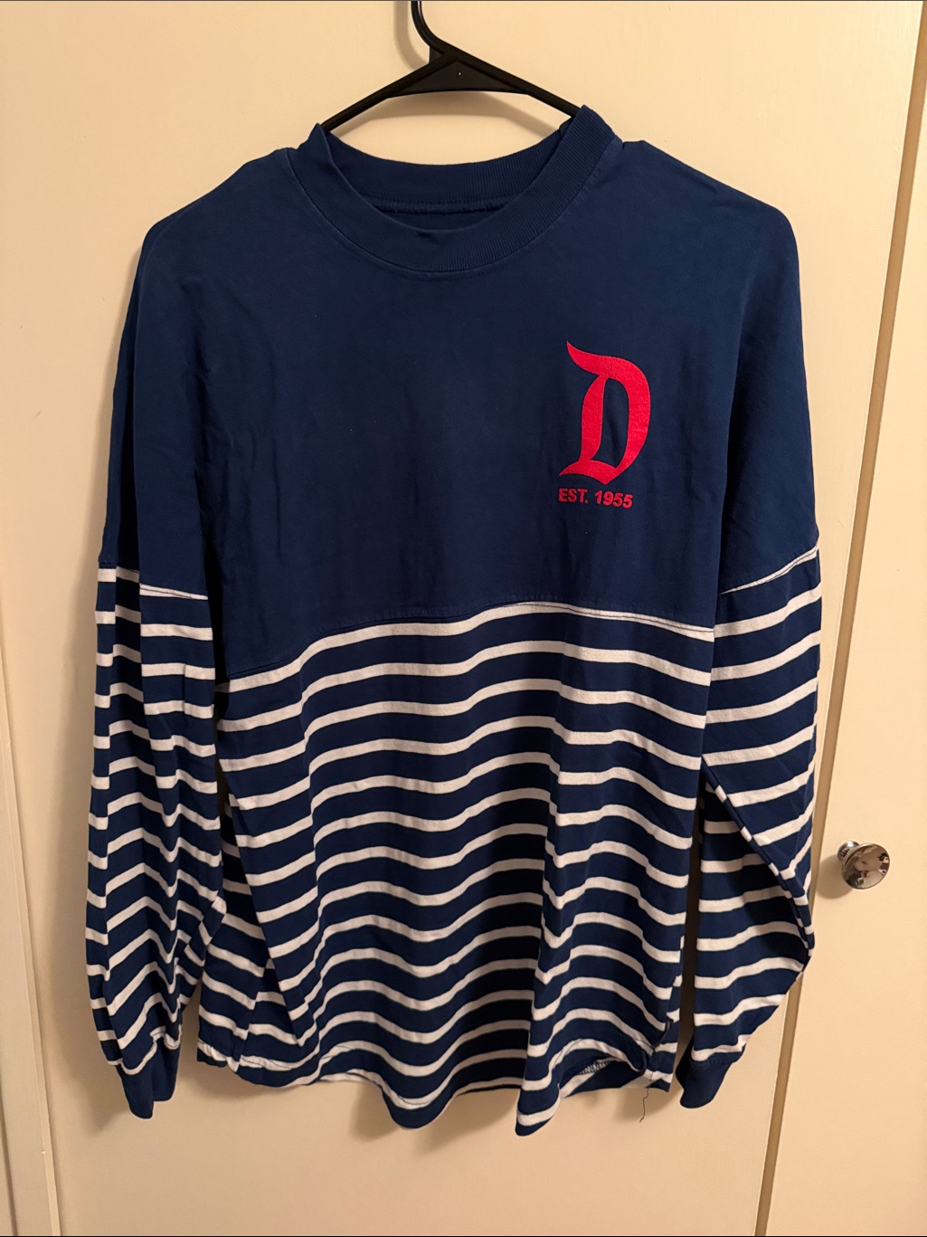 A Disneyland spirit jersey photographed for a US resale marketplace listing in September 2026